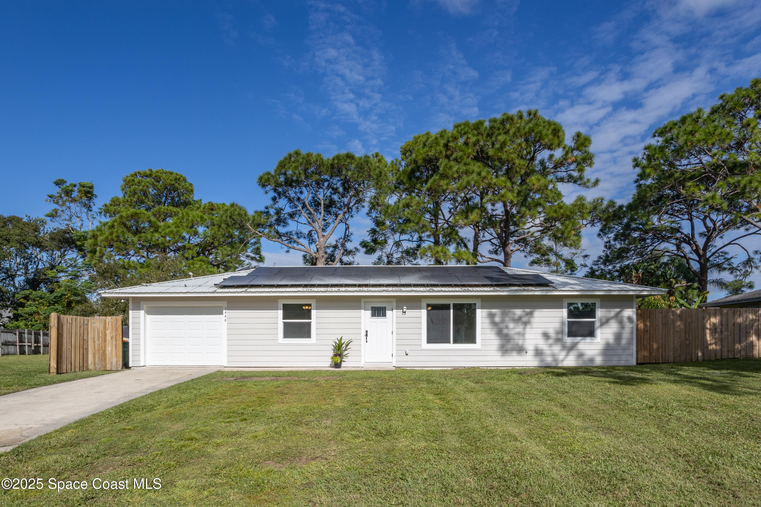 5446 Jamaica Road Cocoa, FL 32927 - Photo 1 of 21 a front view of a house with a garden