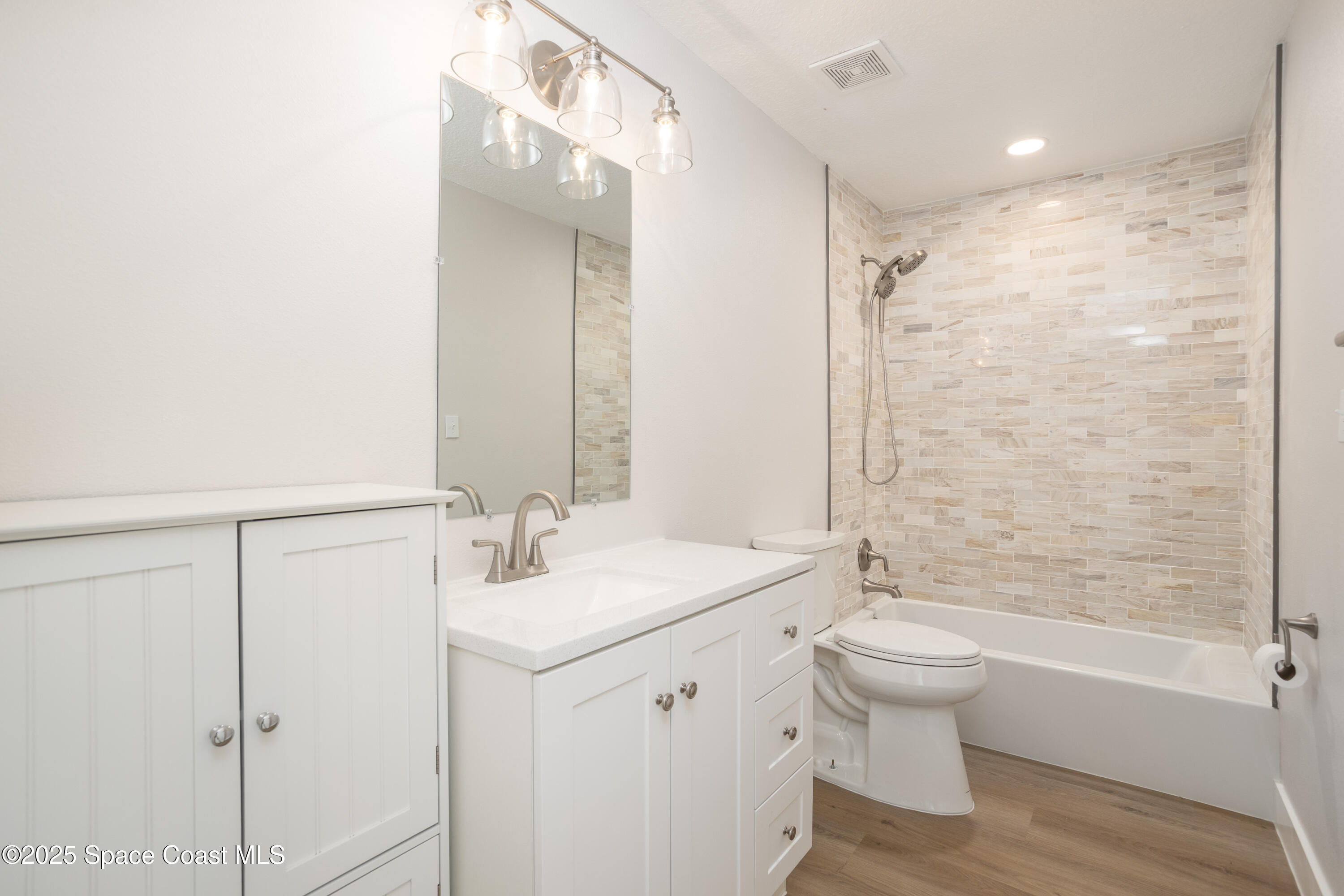 5446 Jamaica Road Cocoa, FL 32927 - Photo 17 of 21 a bathroom with a sink toilet tub and shower