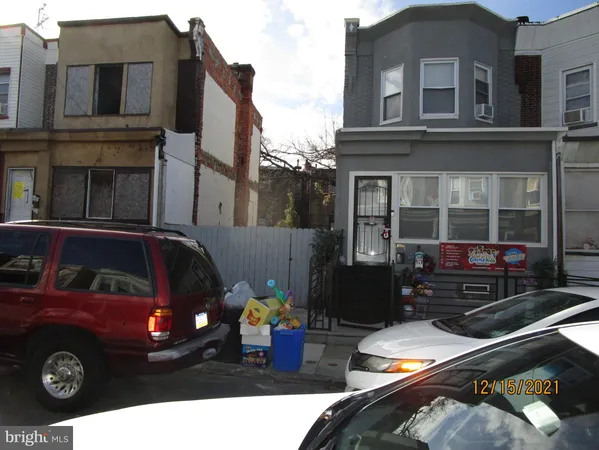 a front view of a house with parking