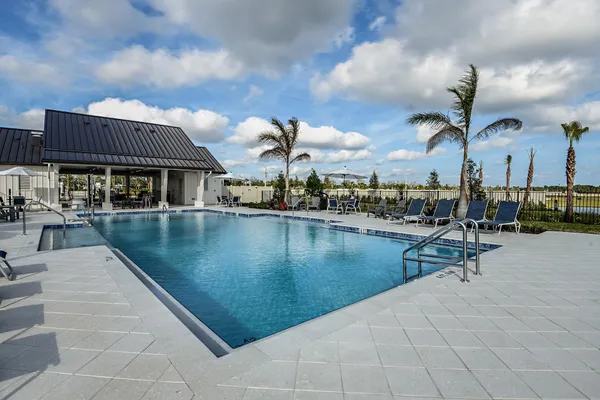 a view of house with yard and lake view