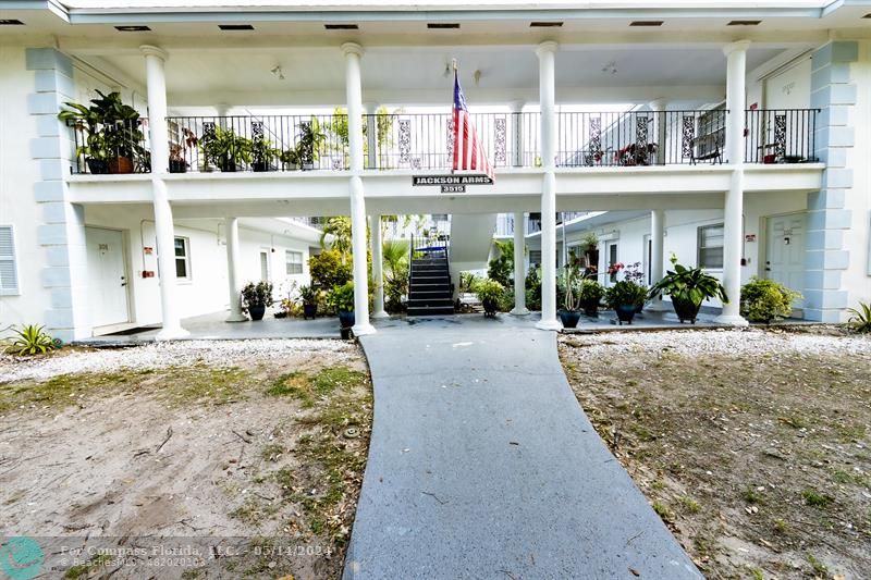 3515 Van Buren Street, Unit A Hollywood, FL 33021 - Photo 3 of 11 a front view of a building with a porch