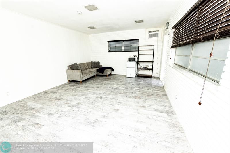 3515 Van Buren Street, Unit A Hollywood, FL 33021 - Photo 7 of 11 a view of a livingroom with furniture and a ceiling fan