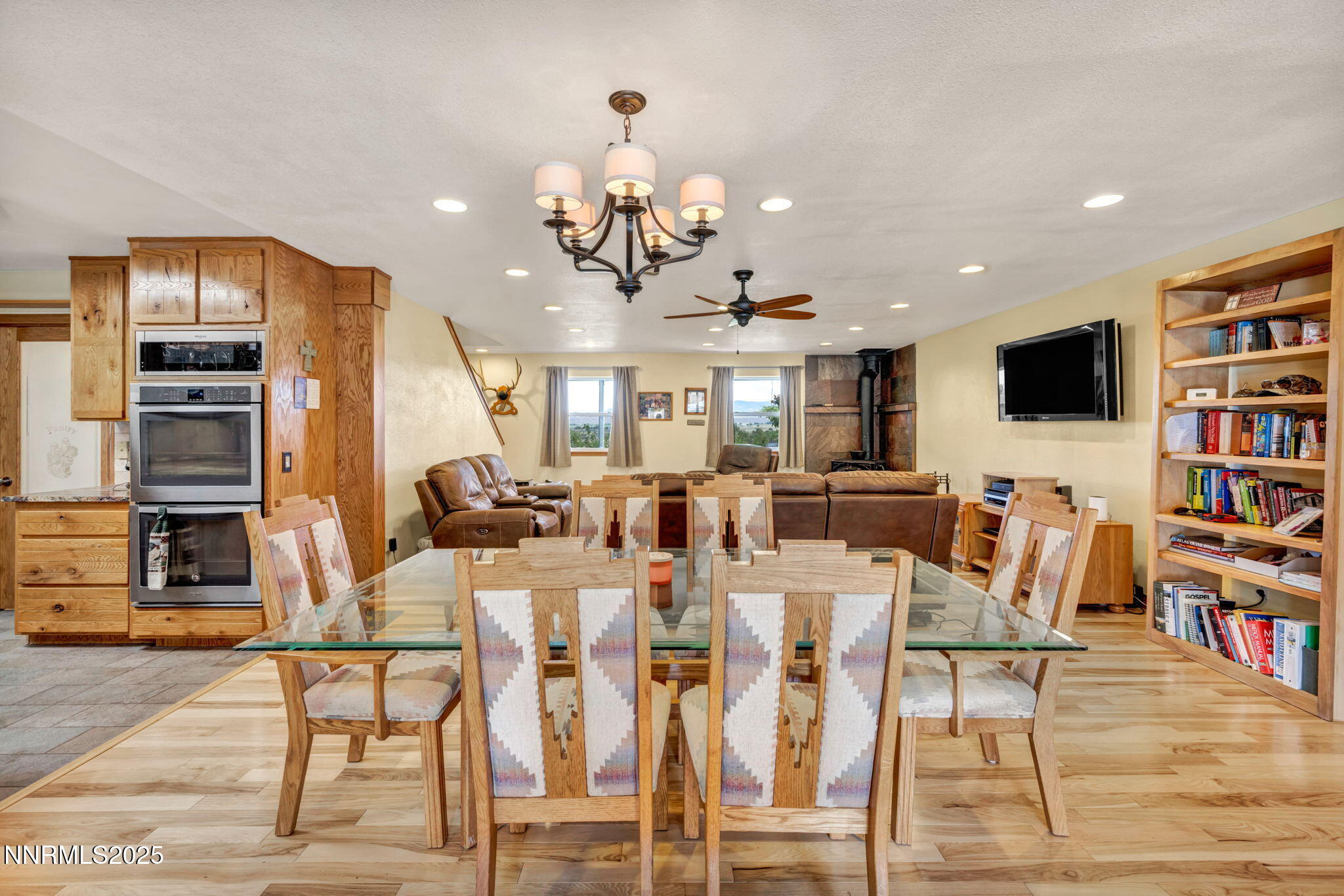 111 Upper Colony Road Wellington, NV 89444 - Photo 13 of 49 a view of a dining room with furniture and a flat screen tv