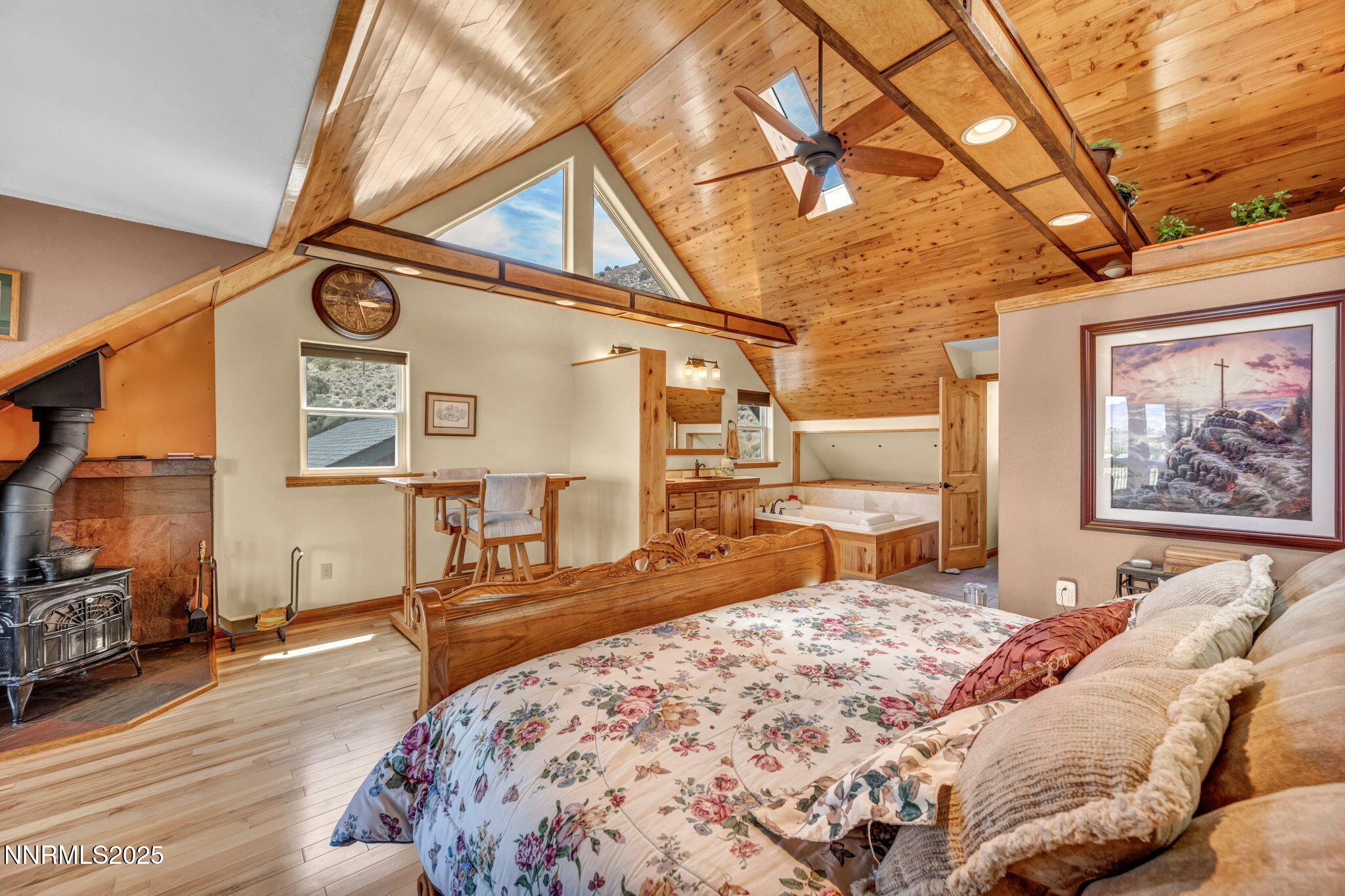 111 Upper Colony Road Wellington, NV 89444 - Photo 15 of 49 a bedroom with a bed a mirror and desk