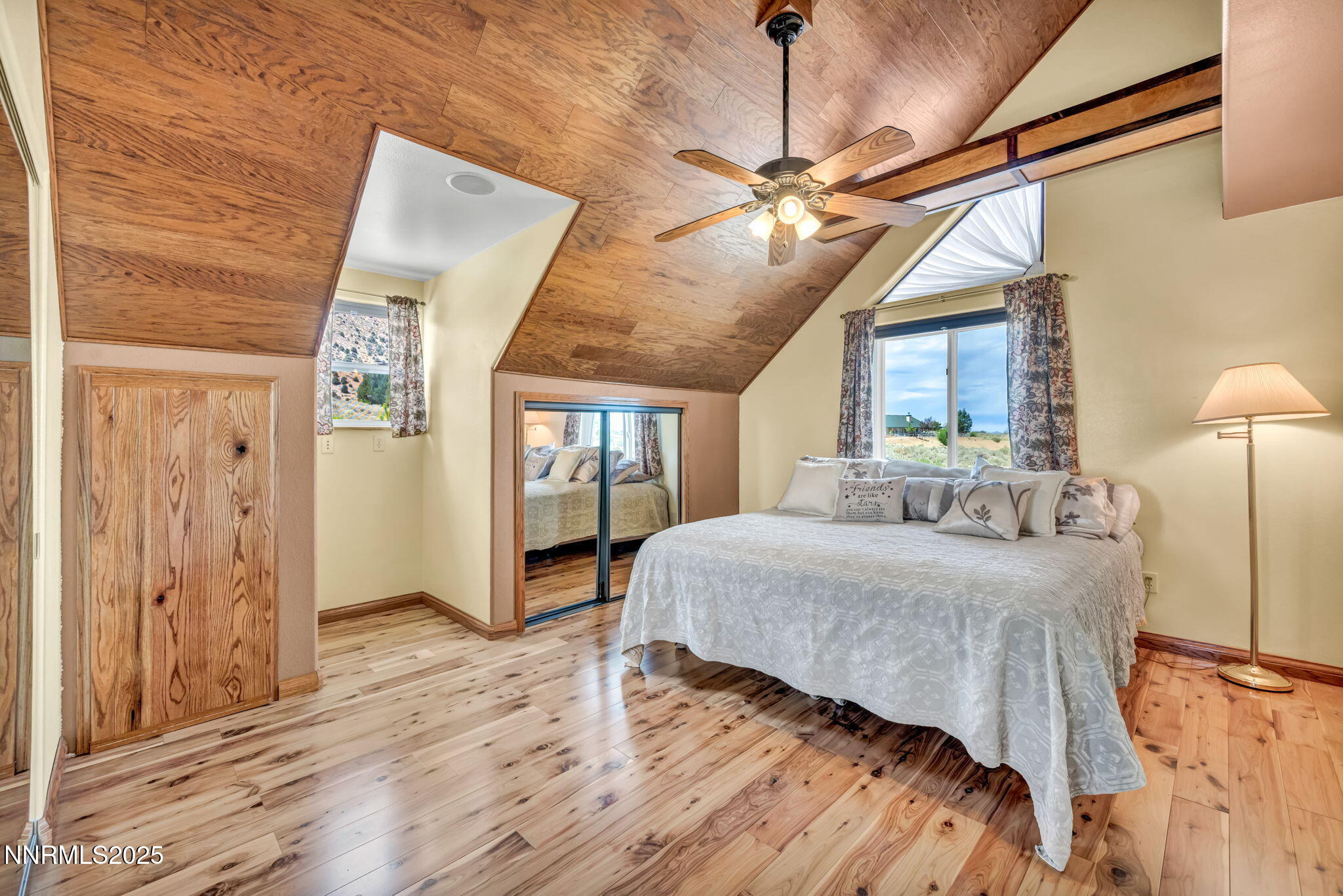 111 Upper Colony Road Wellington, NV 89444 - Photo 18 of 49 a bed room with a bed and a chandelier