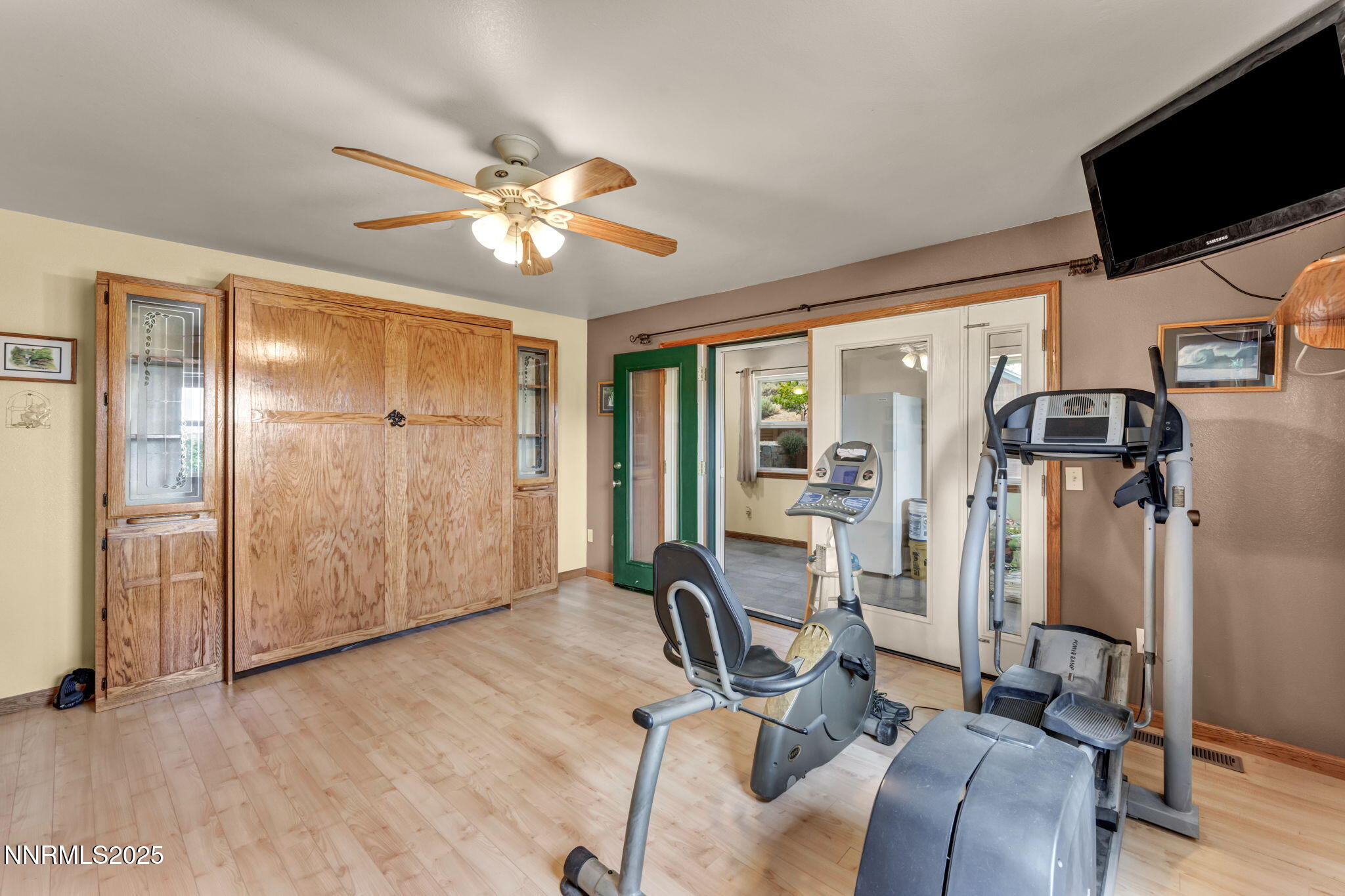 111 Upper Colony Road Wellington, NV 89444 - Photo 20 of 49 a view of a workspace with furniture and a flat screen tv