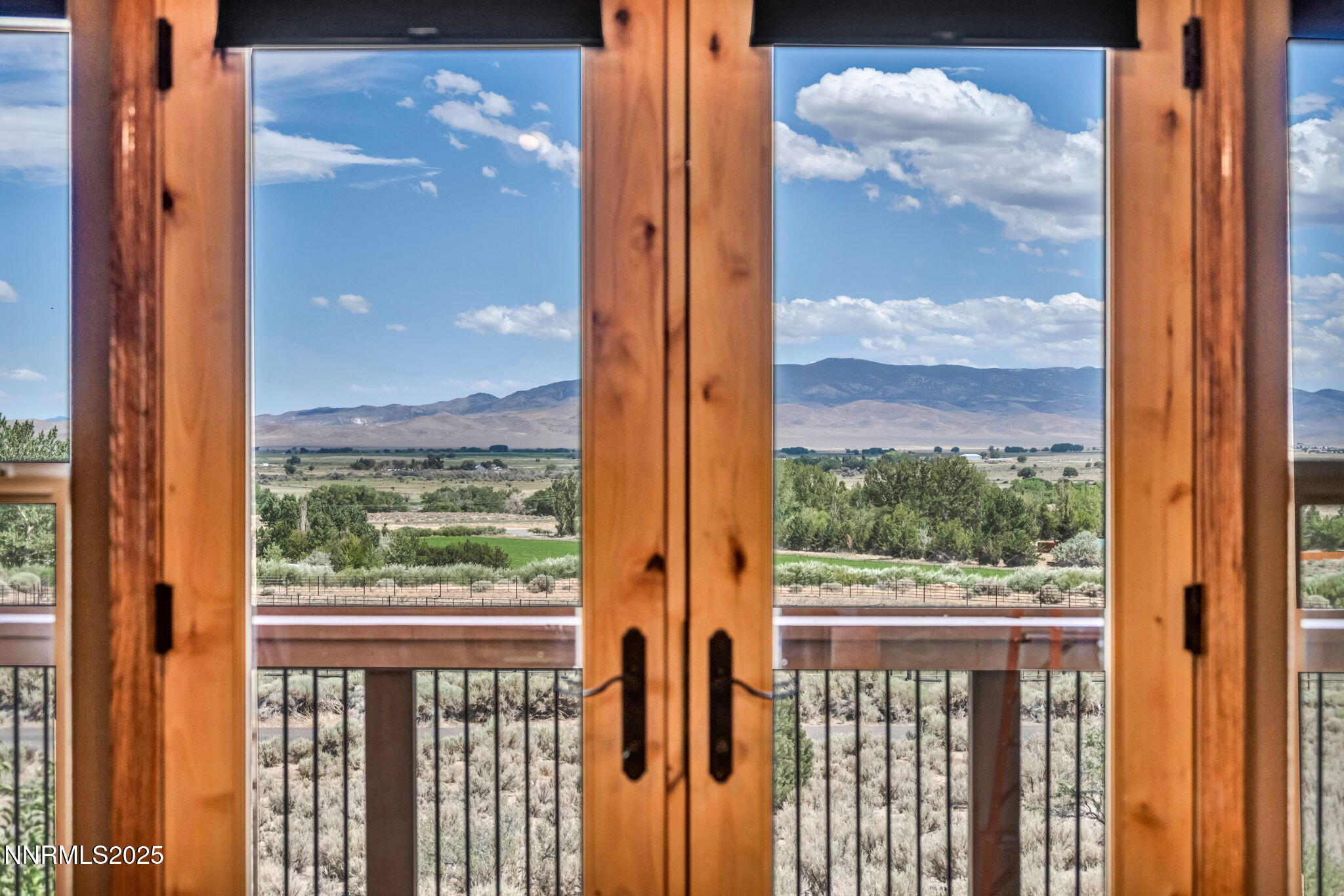 111 Upper Colony Road Wellington, NV 89444 - Photo 22 of 49 a view of a glass door with a view of the balcony