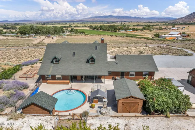 an aerial view of residential houses with outdoor space