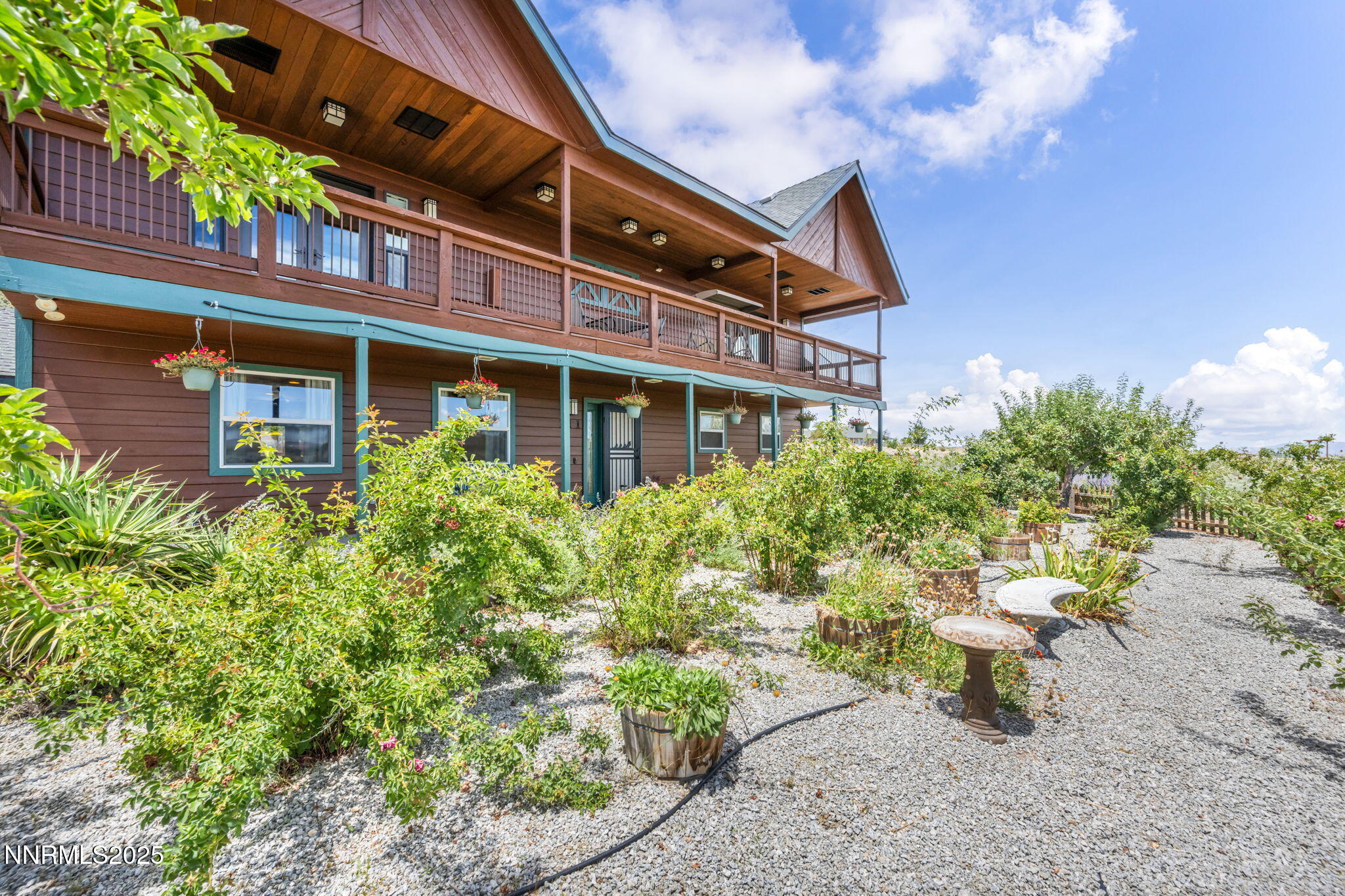 111 Upper Colony Road Wellington, NV 89444 - Photo 37 of 49 a view of a building with outdoor seating and plants