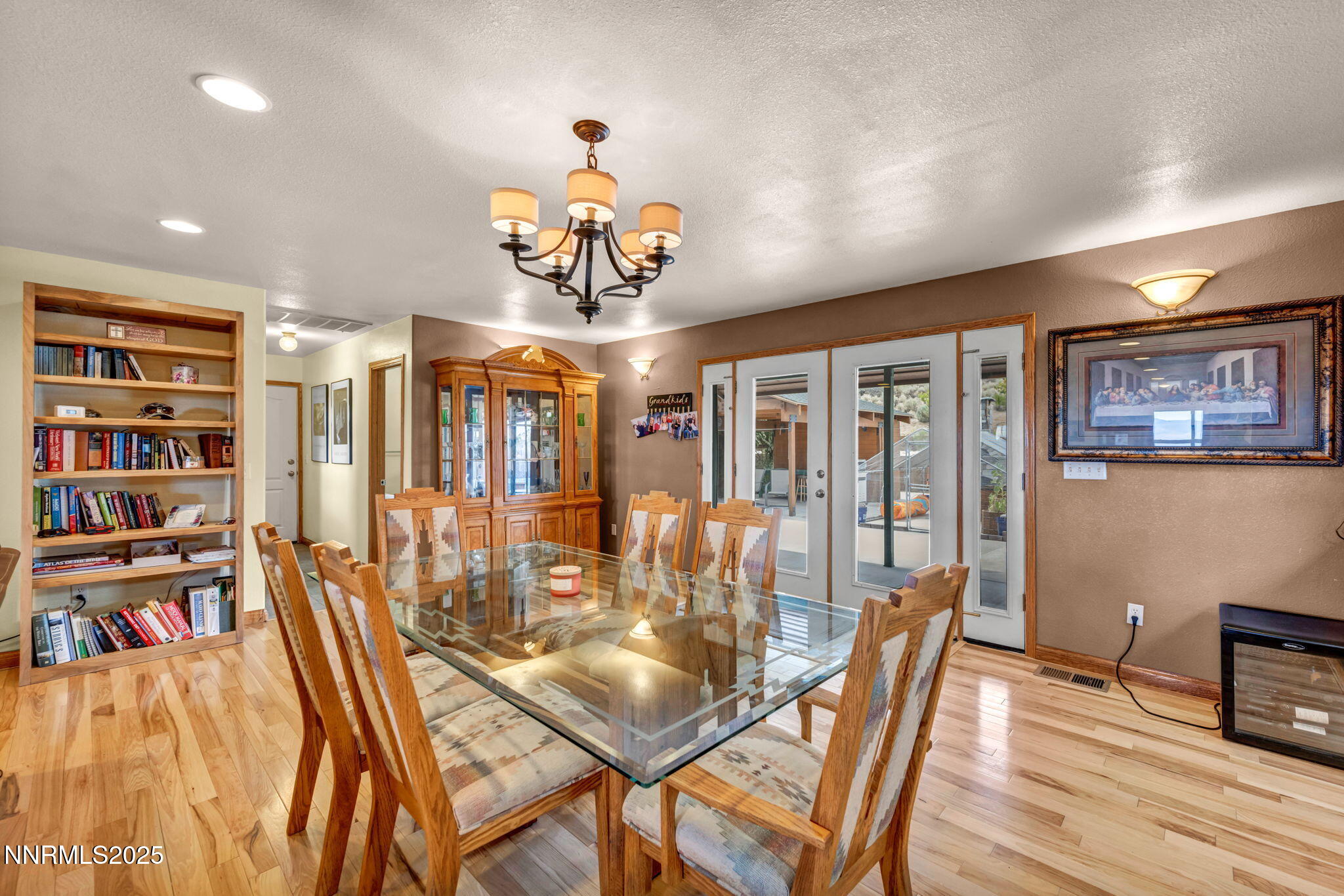 111 Upper Colony Road Wellington, NV 89444 - Photo 7 of 49 a view of a dining room with furniture a rug and wooden floor