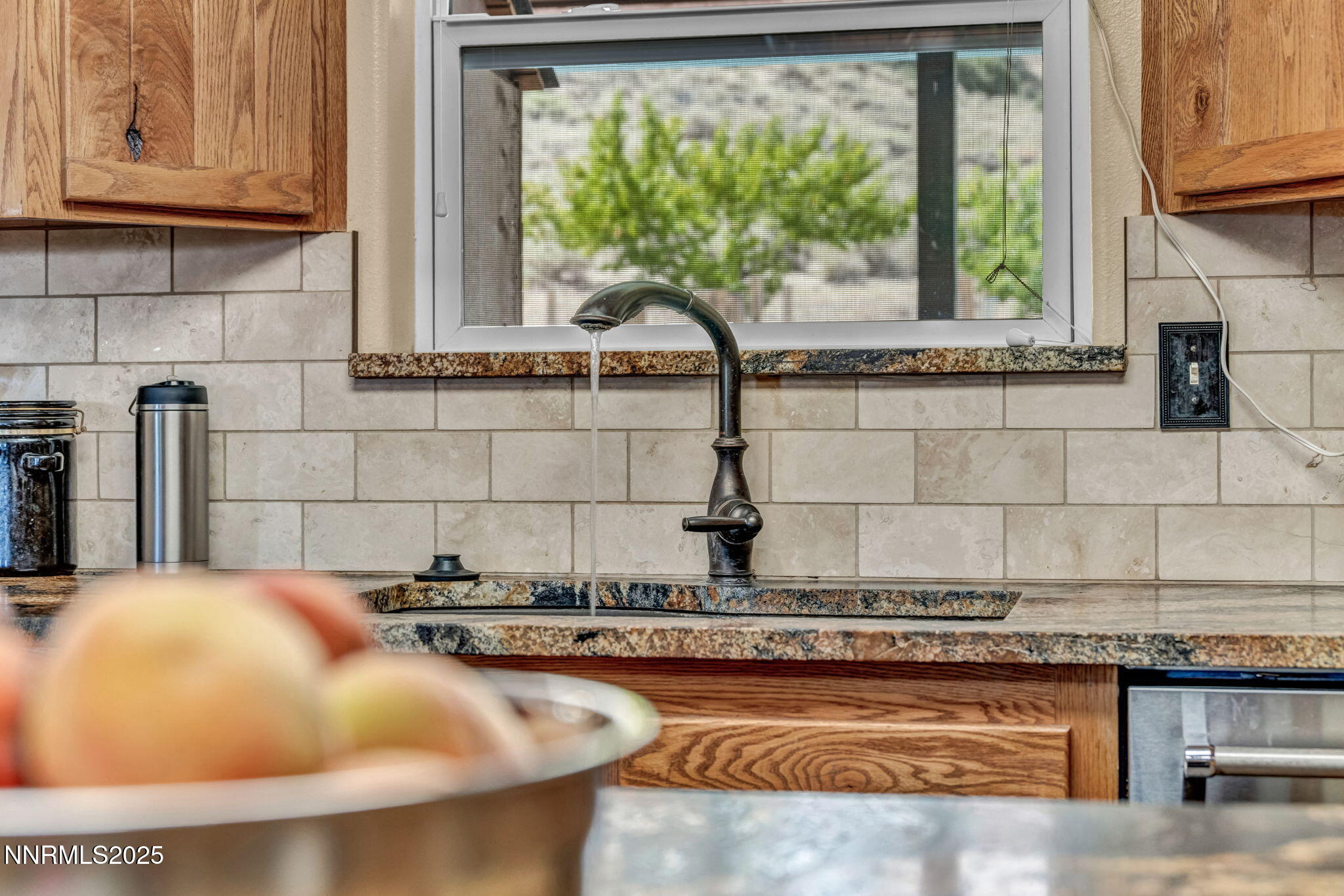 111 Upper Colony Road Wellington, NV 89444 - Photo 9 of 49 a kitchen with granite countertop a sink and a window