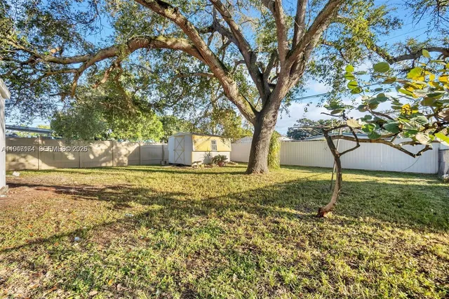 a backyard of a house with lots of green space