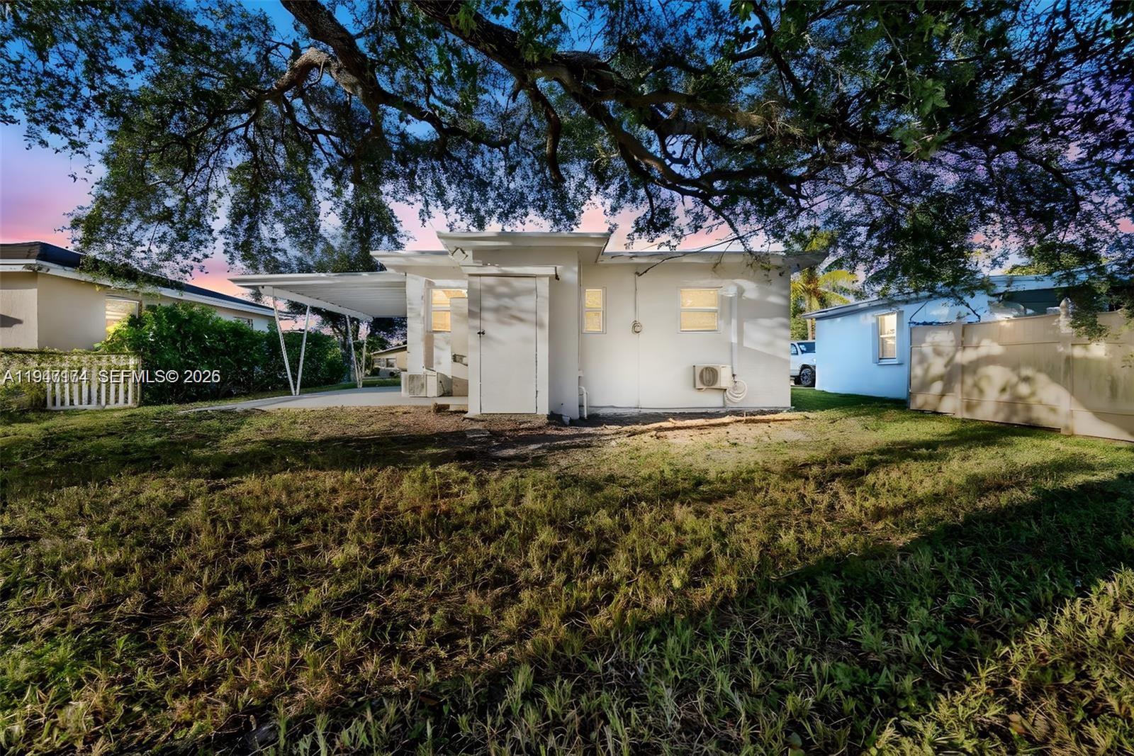 6326 Southwest 24th Street Miramar, FL 33023 - Photo 9 of 14 a view of a house with a yard