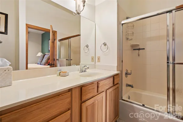 a view of a house with backyard and trees