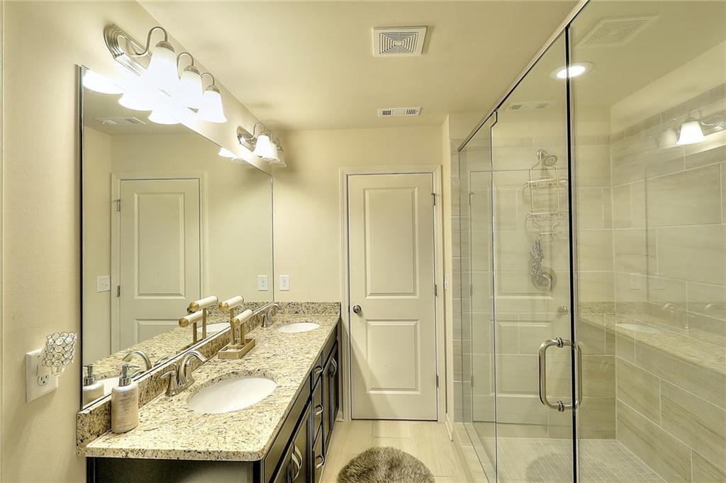 1306 Harris Way South Atlanta, GA 30319 - Photo 9 of 19 a bathroom with a granite countertop sink mirror and shower