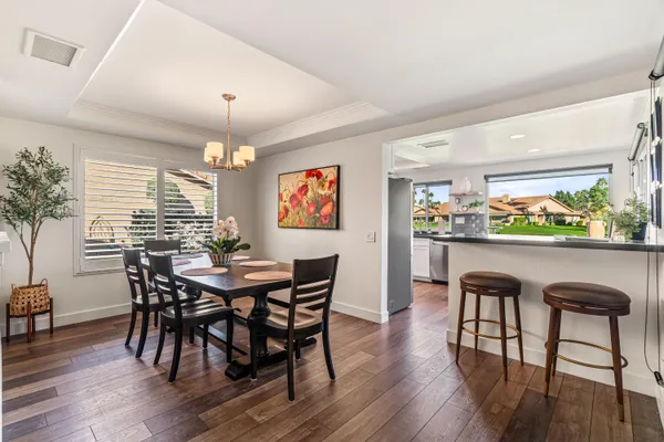 a kitchen with stainless steel appliances granite countertop a sink a stove a microwave and cabinets