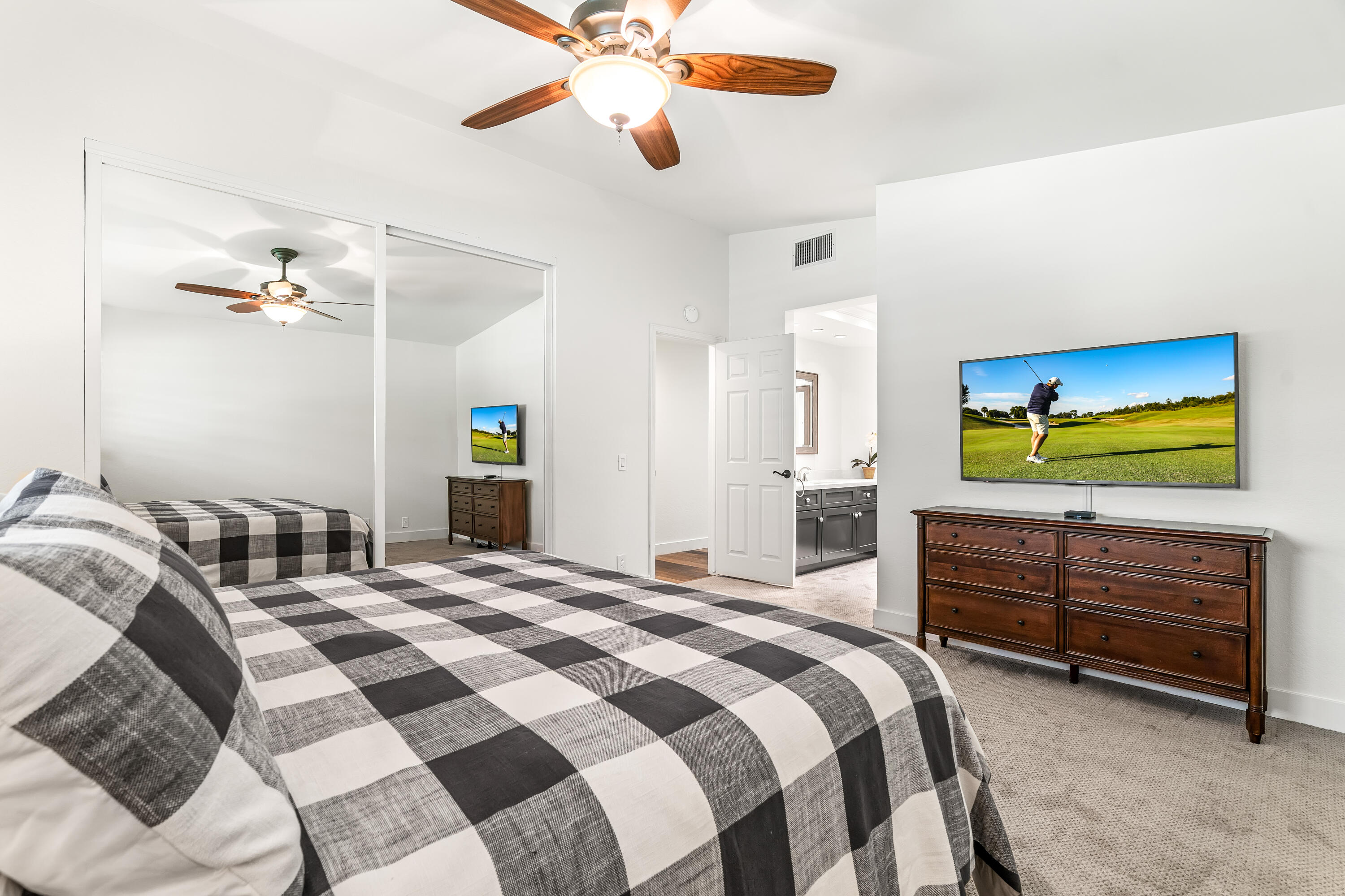 82 Conejo Circle Palm Desert, CA 92260 - Photo 17 of 58 a bedroom with a bed and a flat screen tv