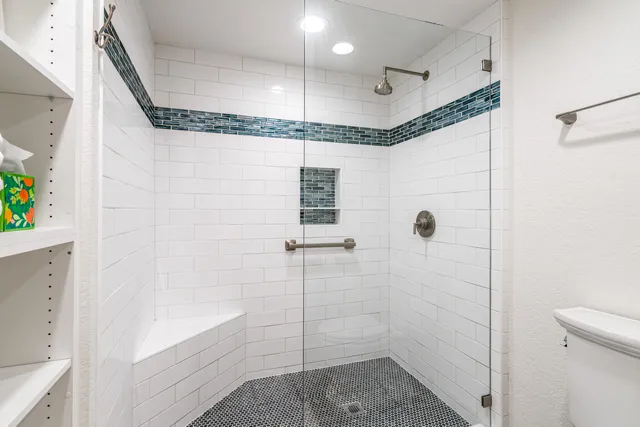 a row of palm trees and a yard with swimming pool