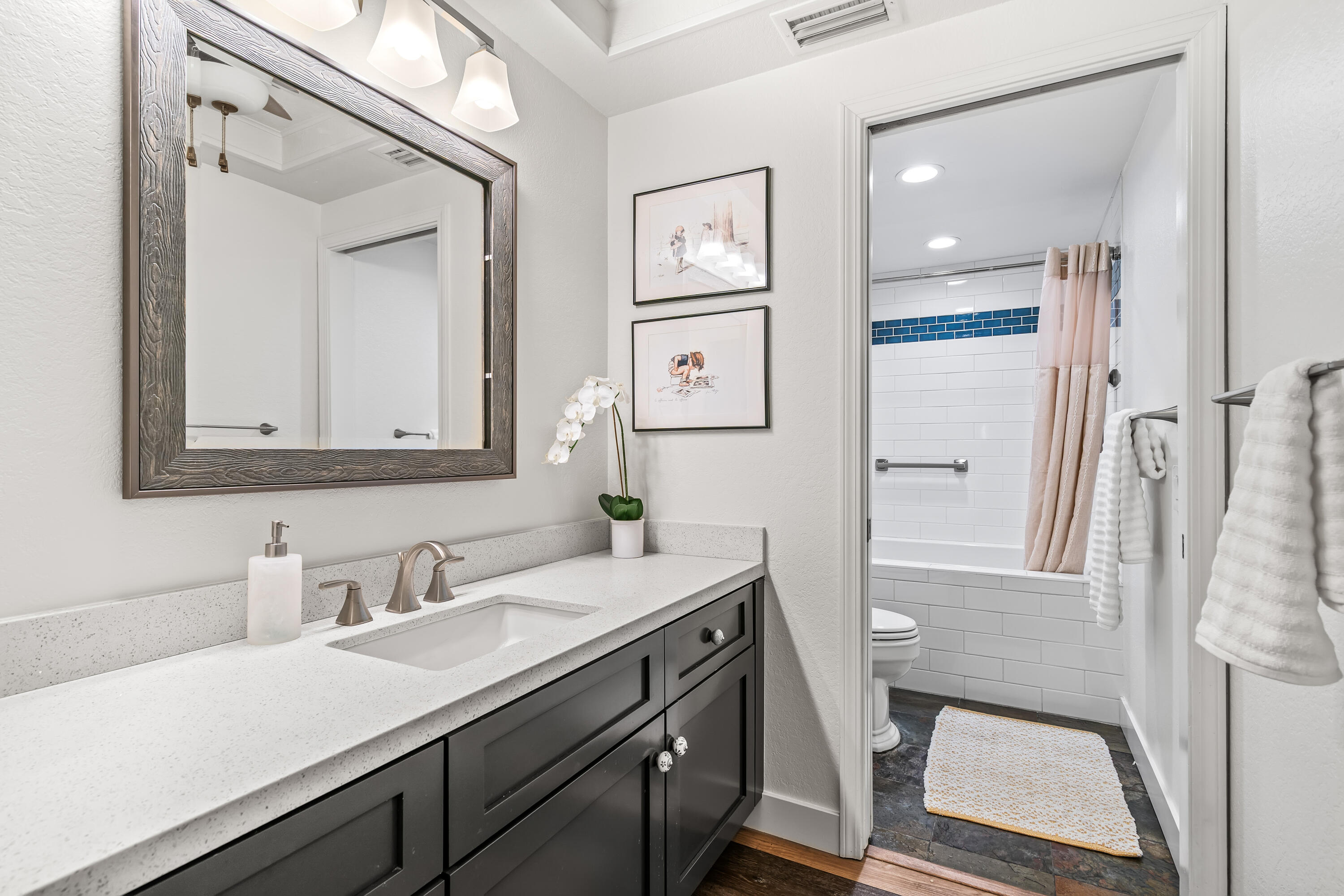 82 Conejo Circle Palm Desert, CA 92260 - Photo 25 of 58 a bathroom with a sink a mirror a vanity and a shower