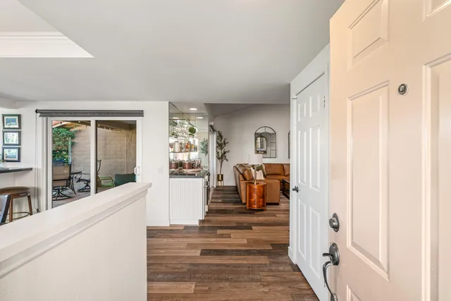 a living room with furniture a window and a fireplace