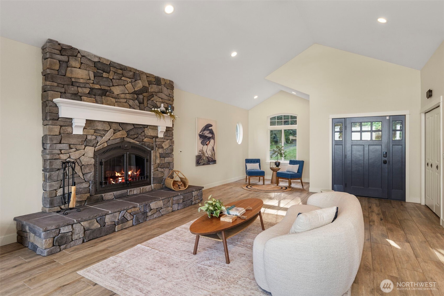 32326 Hoffman Road Northeast Kingston, WA 98346 - Photo 11 of 40 a living room with furniture and a fireplace