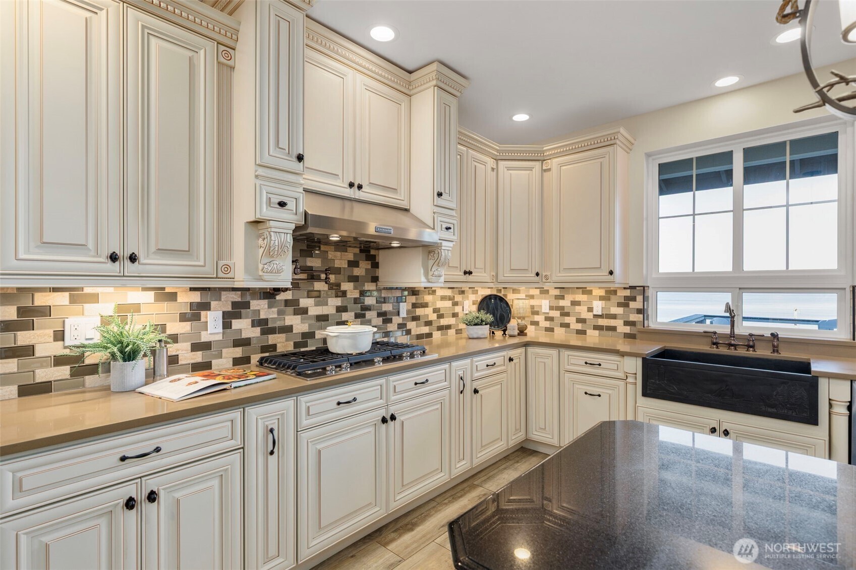 32326 Hoffman Road Northeast Kingston, WA 98346 - Photo 18 of 40 a kitchen with white cabinets and sink