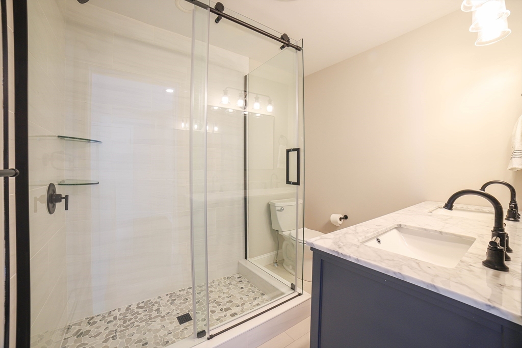 3 Woods Road Westminster, MA 01473 - Photo 32 of 42 a bathroom with a granite countertop sink a shower and mirror