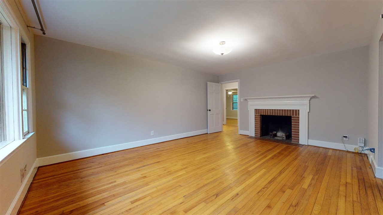 2516 North Roxboro Street Durham, NC 27704 - Photo 3 of 24 Reverse angle shows fire place and beautiful hardwood floors. Living Room