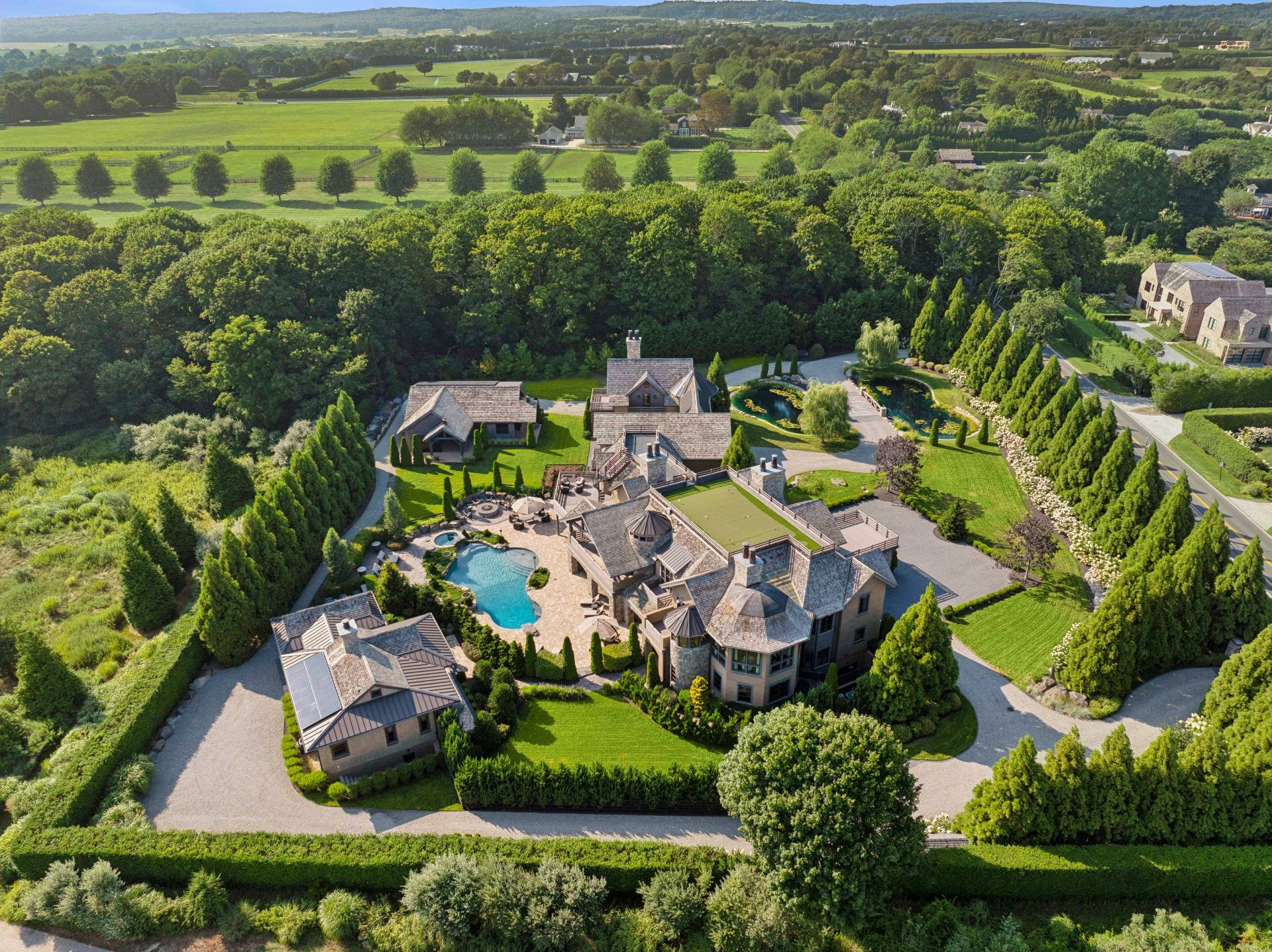 254 Mitchell Lane Bridgehampton, NY 11932 - Photo 1 of 36 an aerial view of a house with a garden
