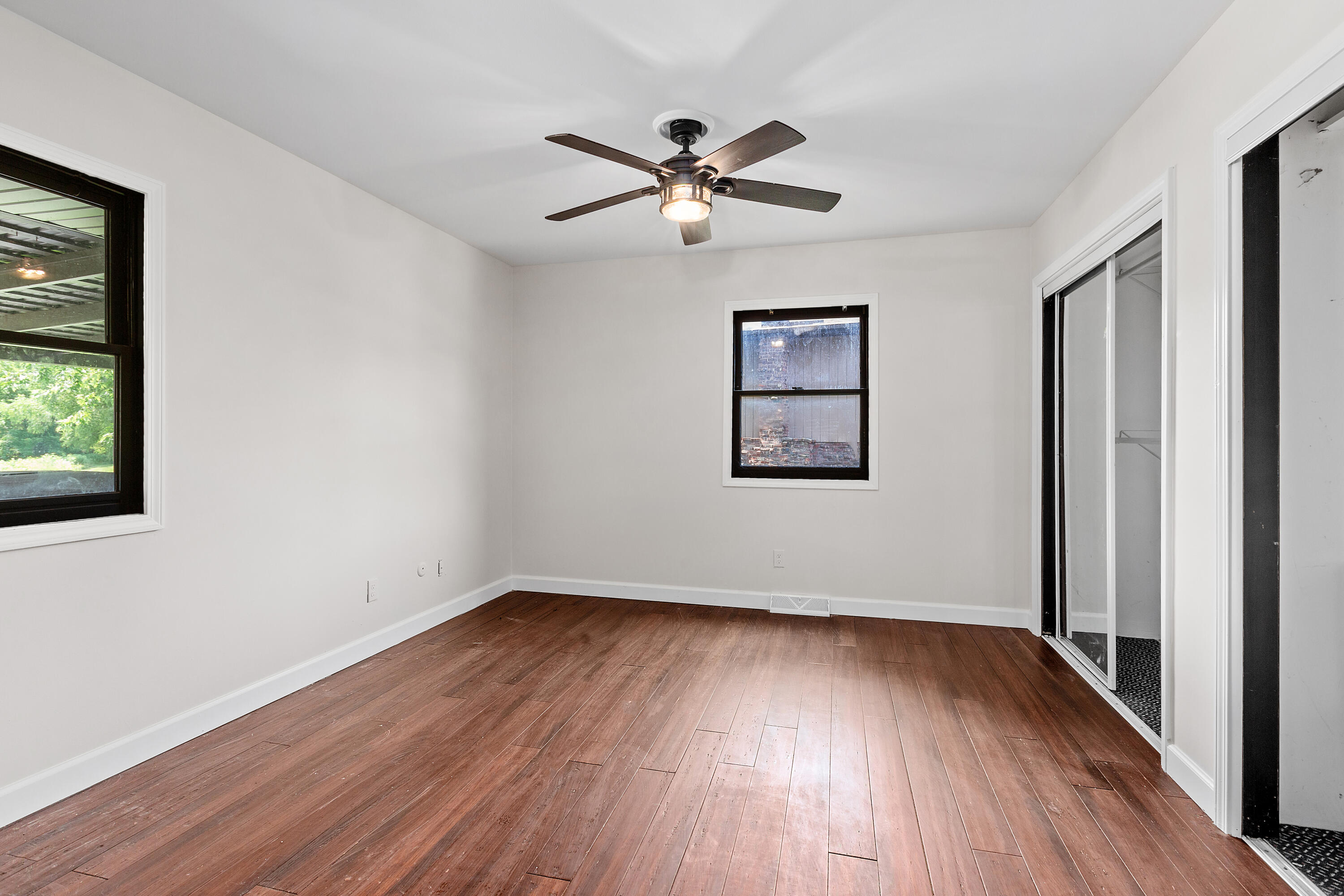 4152 Oakmont Court Crown Point, IN 46307 - Photo 16 of 34 a view of empty room with wooden floor and fan