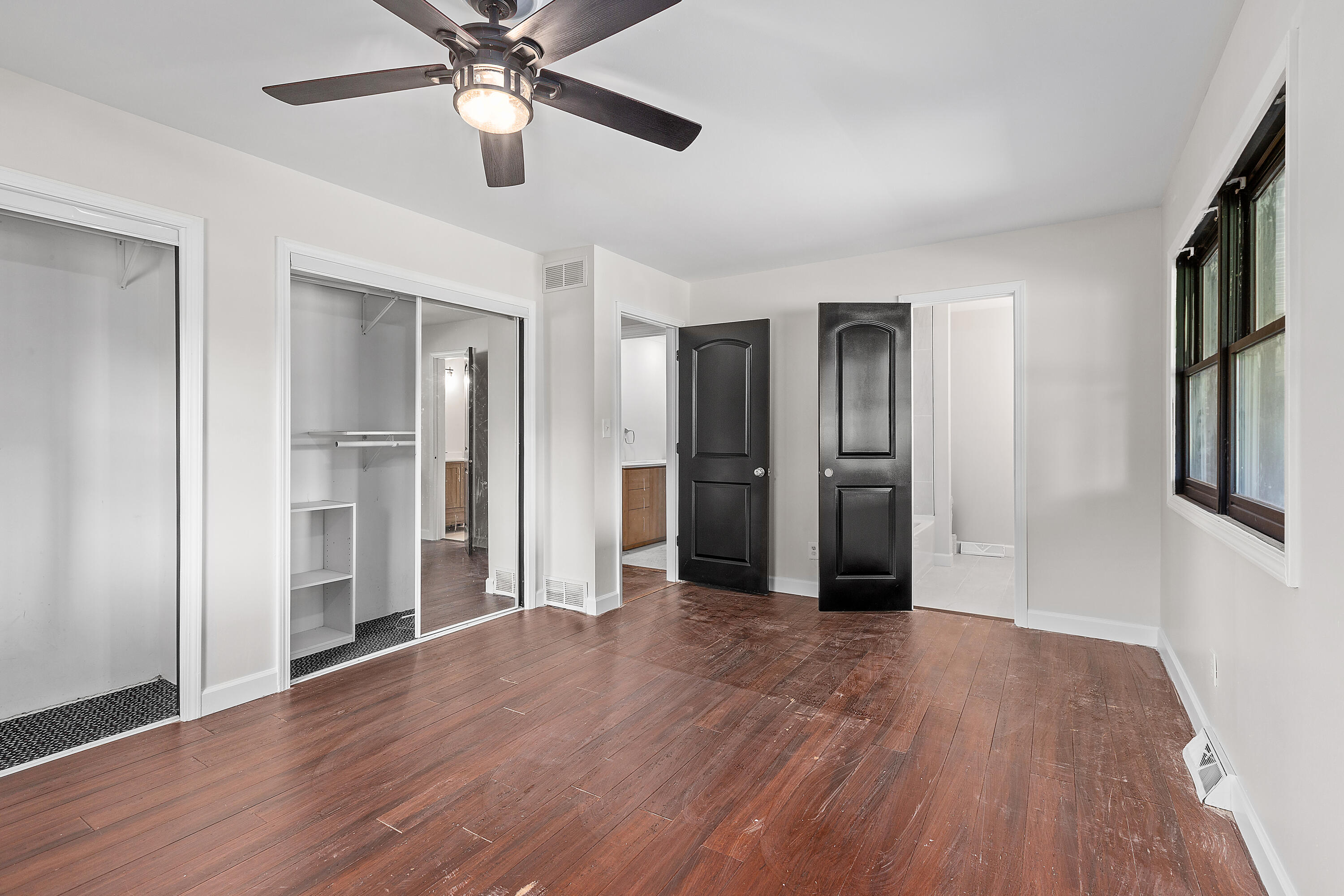 4152 Oakmont Court Crown Point, IN 46307 - Photo 17 of 34 a view of a big room with wooden floor and a ceiling fan