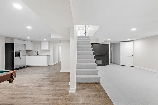 a view of an entryway with wooden floor