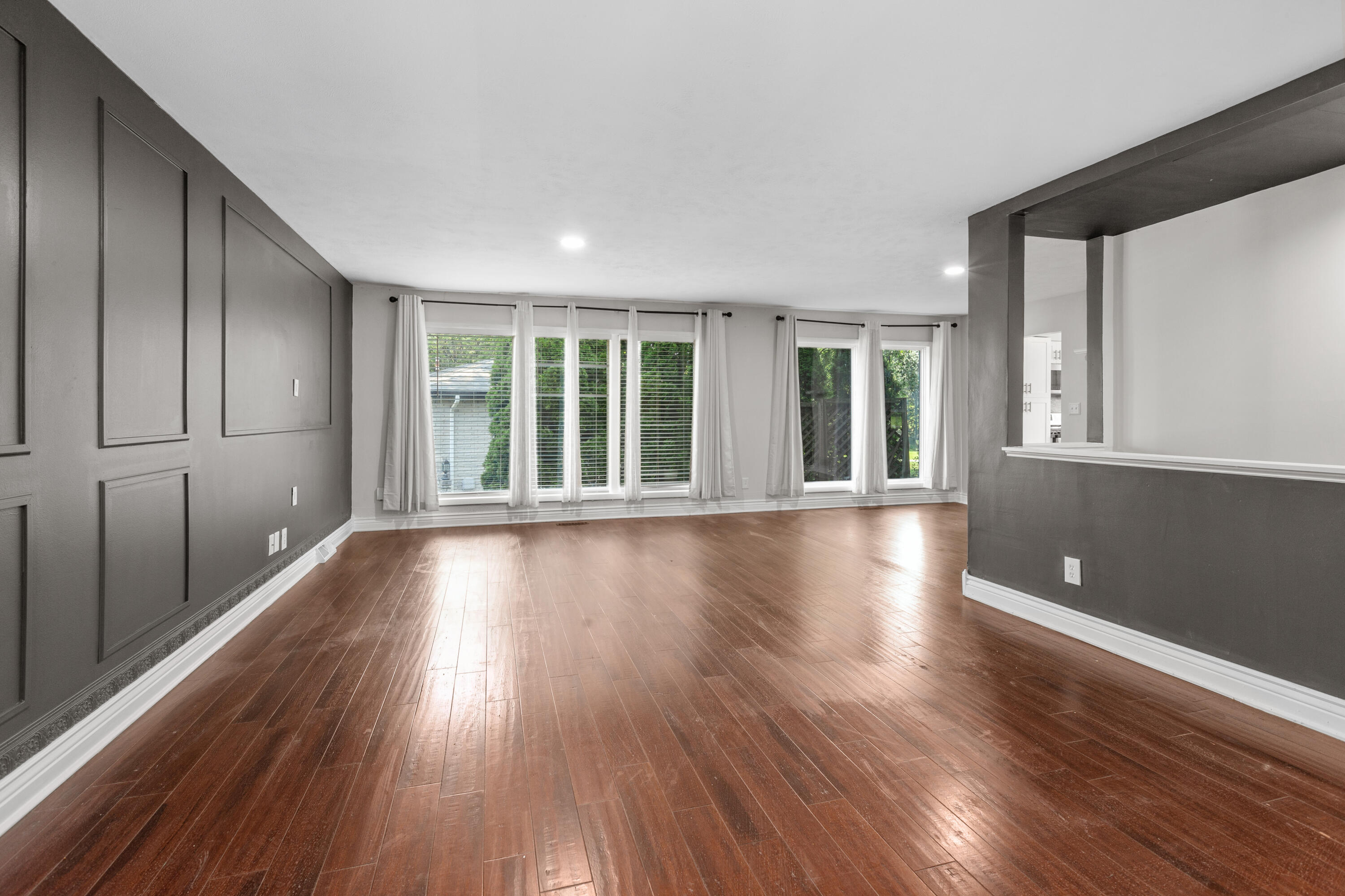 4152 Oakmont Court Crown Point, IN 46307 - Photo 3 of 34 wooden floor in an empty room with a window