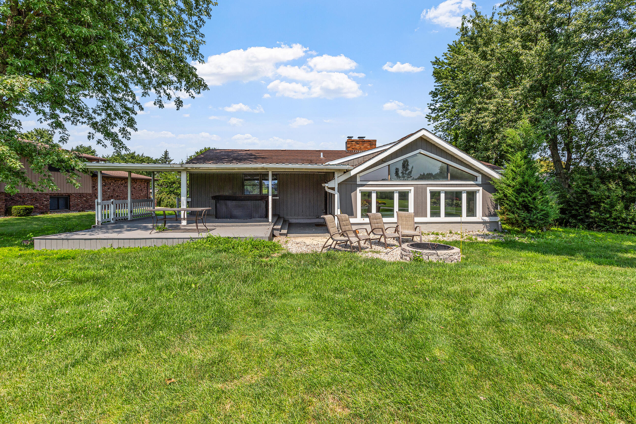 4152 Oakmont Court Crown Point, IN 46307 - Photo 33 of 34 a front view of a house with a yard table and chairs