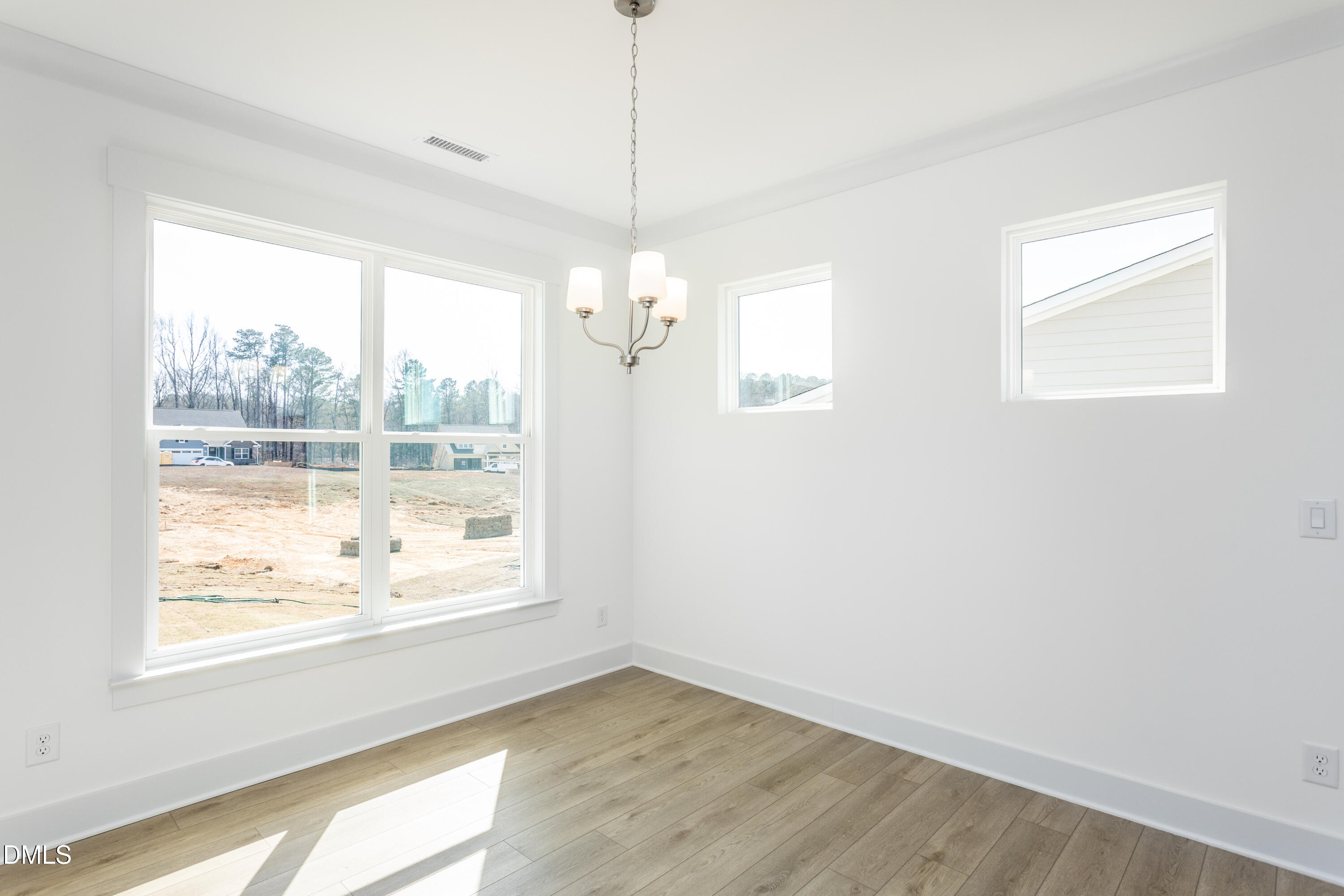 70 Slippery Elm Road Youngsville, NC 27596 - Photo 13 of 32 a view of an empty room with a window