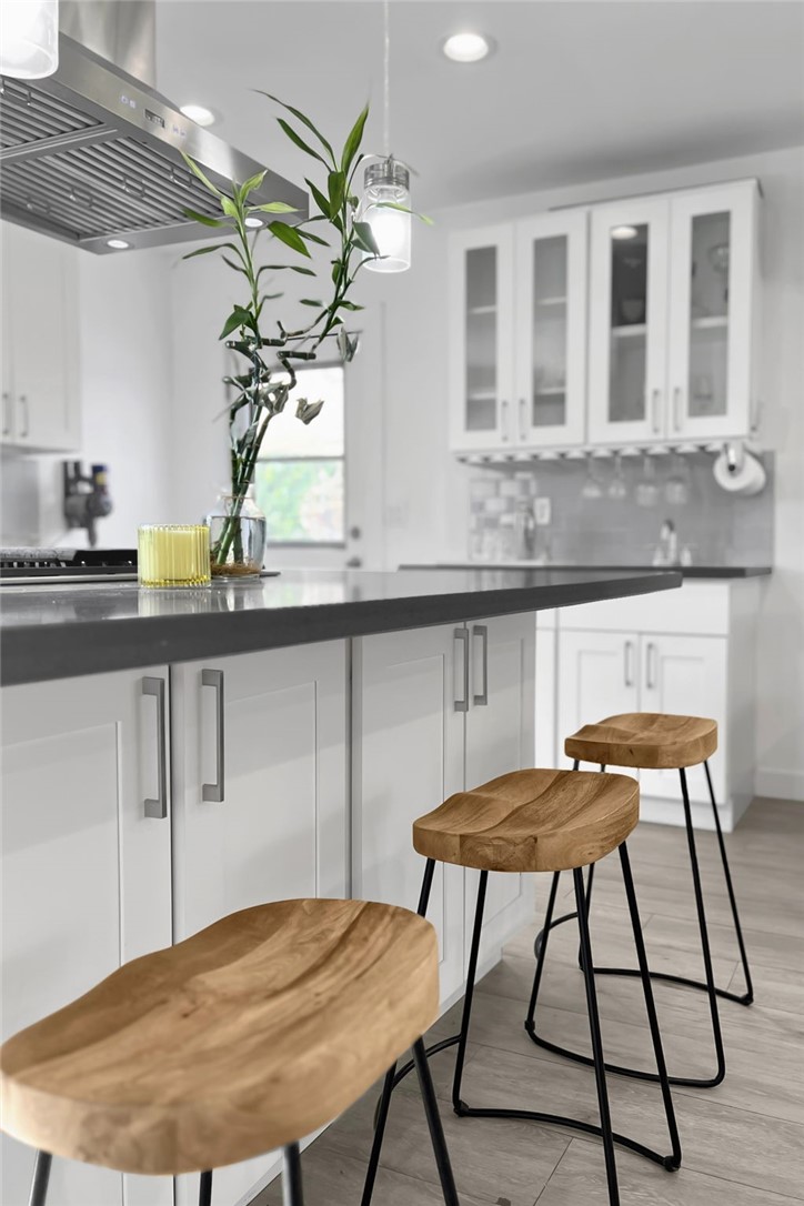 3541 Gibson Road El Monte, CA 91731 - Photo 14 of 38 a table chair and a potted plant sitting on a table