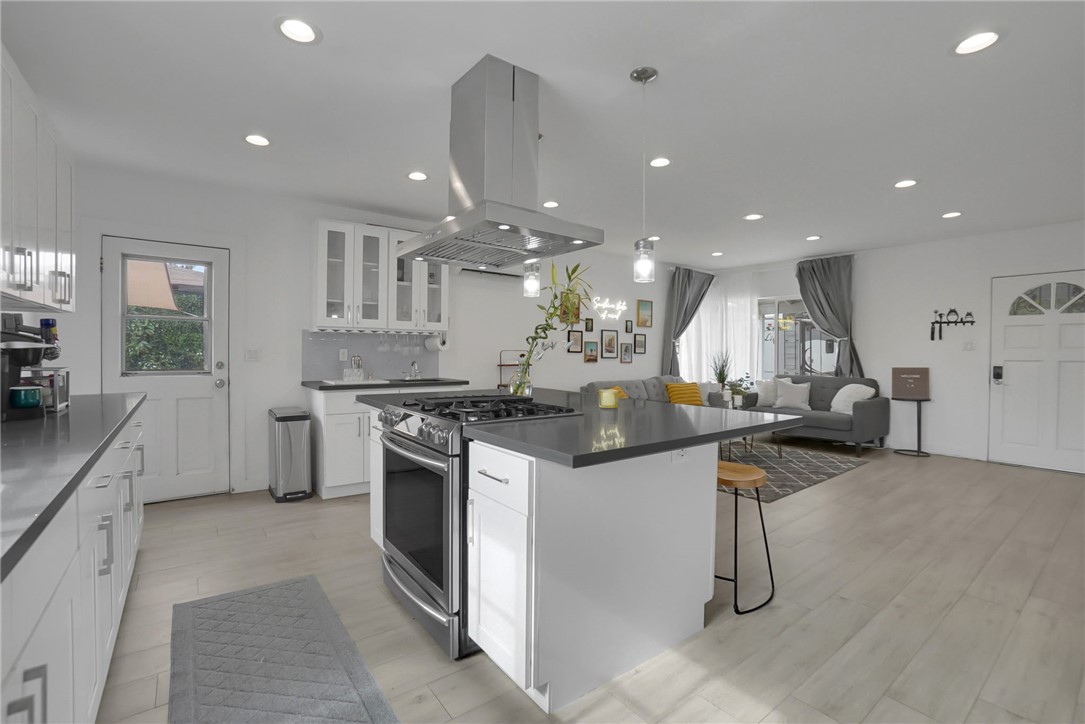 3541 Gibson Road El Monte, CA 91731 - Photo 19 of 38 a kitchen with stainless steel appliances kitchen island granite countertop a sink and cabinets