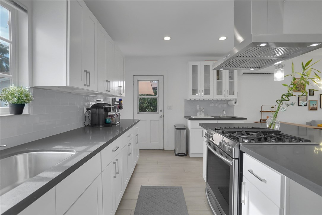 3541 Gibson Road El Monte, CA 91731 - Photo 20 of 38 a kitchen with stainless steel appliances granite countertop a sink stove and cabinets