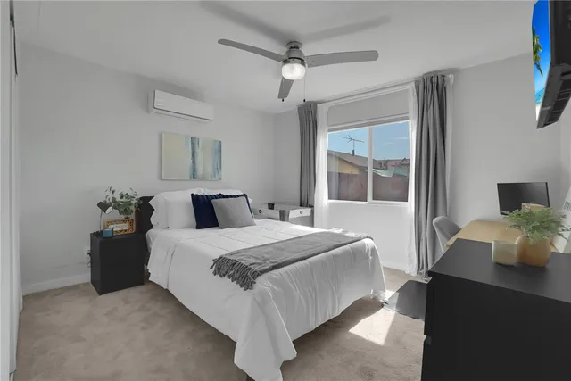 a bedroom with a bed and window