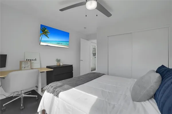 a bedroom with a bed and a chair