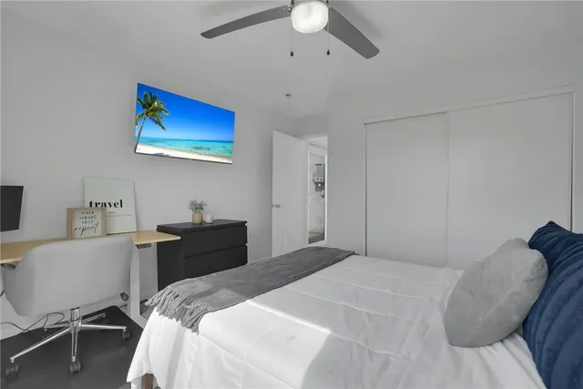 a bedroom with a bed and a chair