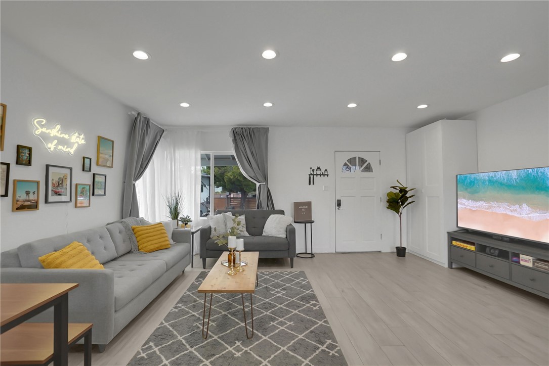 3541 Gibson Road El Monte, CA 91731 - Photo 3 of 38 a living room with furniture and a flat screen tv