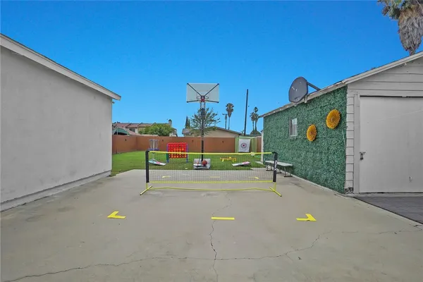 a view of a tennis court with a tree