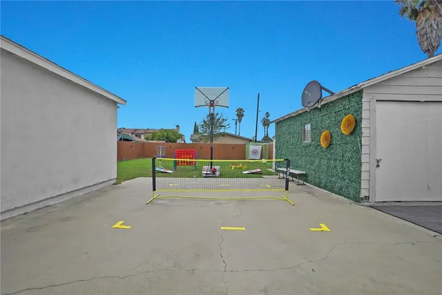 a view of a tennis court with a tree