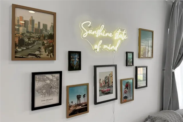 a view of a hallway with paintings on the wall