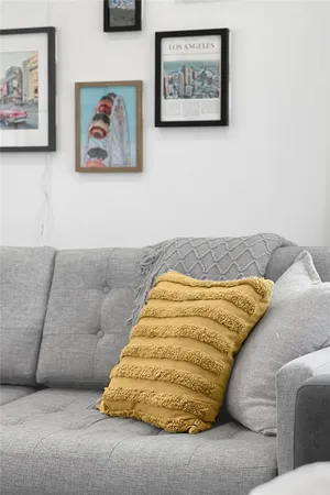 a bedroom with a bed and painting on the wall