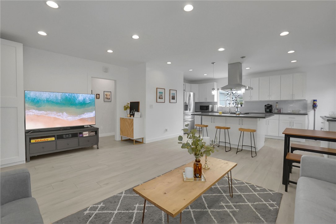 3541 Gibson Road El Monte, CA 91731 - Photo 9 of 38 a living room with stainless steel appliances kitchen island furniture and a flat screen tv