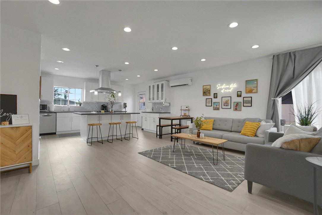 3541 Gibson Road El Monte, CA 91731 - Photo 10 of 38 a living room with furniture wooden floor and a kitchen