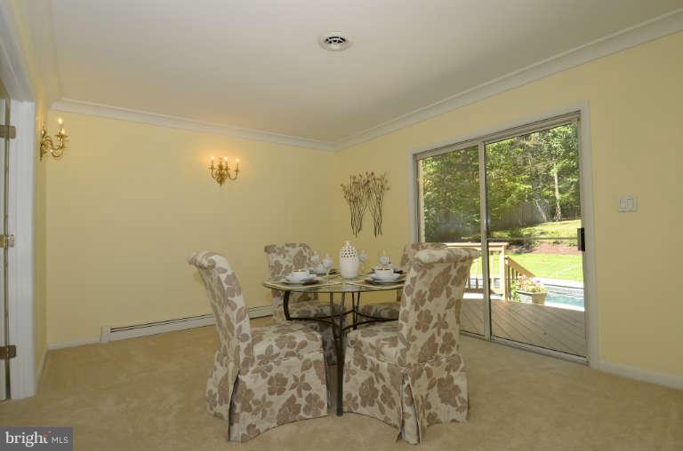 10628 Hunters Valley Road Vienna, VA 22181 - Photo 6 of 30 Formal dining room with doors to deck
