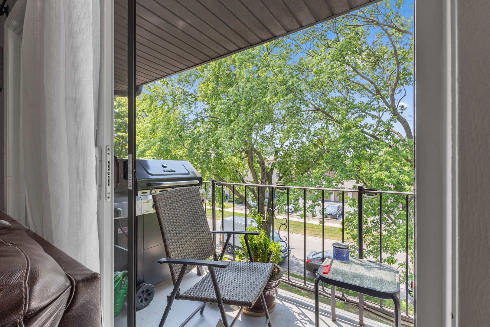 7006 98th Street, Unit 3B Chicago Ridge, IL 60415 - Photo 5 of 20 a balcony with chairs